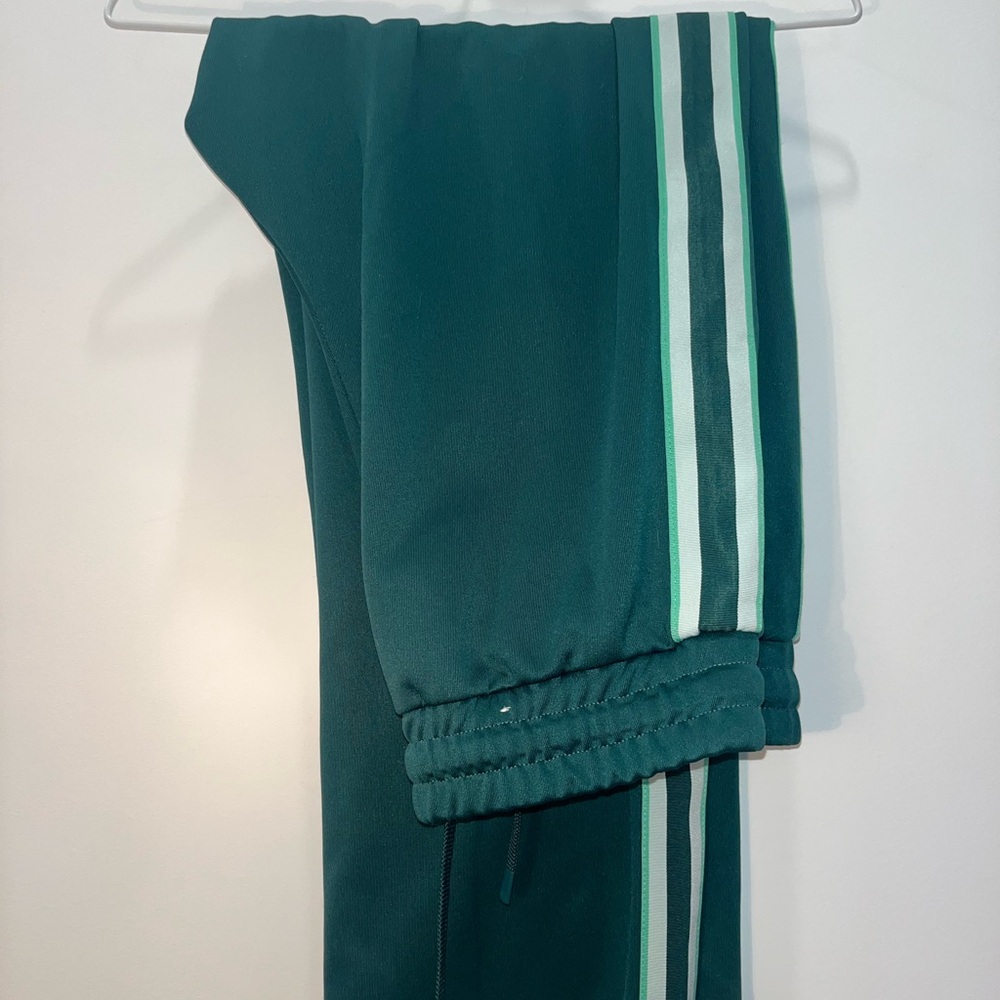 h&m green track pants with stripe down side